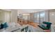 Open living space with a view of the kitchen and access to the balcony at 1111 N Gulfstream Ave # 4E, Sarasota, FL 34236