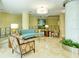 Lobby sitting area with curved sofa and patterned chairs at 1111 N Gulfstream Ave # 4E, Sarasota, FL 34236