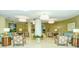 Elegant lobby with comfortable seating, a large chandelier, and artwork at 1111 N Gulfstream Ave # 4E, Sarasota, FL 34236