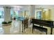 Lobby with a grand piano and seating area at 1111 N Gulfstream Ave # 4E, Sarasota, FL 34236