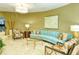 Lobby sitting area with curved sofa and patterned chairs at 1111 N Gulfstream Ave # 4E, Sarasota, FL 34236