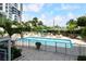 Refreshing community pool with ample lounge chairs and patio furniture at 1111 N Gulfstream Ave # 4E, Sarasota, FL 34236