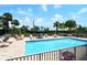 Inviting community pool with plenty of lounge chairs for sunbathing at 1111 N Gulfstream Ave # 4E, Sarasota, FL 34236