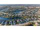Aerial view showcasing a home's location in a desirable neighborhood near a lake at 12031 Longview Lake Cir, Bradenton, FL 34211