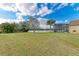 Landscaped backyard with pond view at 12031 Longview Lake Cir, Bradenton, FL 34211
