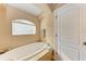 Oval soaking tub, tile flooring, and a separate shower at 12031 Longview Lake Cir, Bradenton, FL 34211