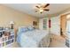 Bedroom with built-in shelving and ceiling fan at 12031 Longview Lake Cir, Bradenton, FL 34211
