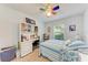 Bedroom with built-in desk and ceiling fan at 12031 Longview Lake Cir, Bradenton, FL 34211