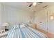 Bedroom with a ceiling fan and string lights at 12031 Longview Lake Cir, Bradenton, FL 34211