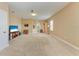 Spacious bonus room with carpeting, TV, and built-in shelving at 12031 Longview Lake Cir, Bradenton, FL 34211