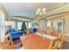 Dining area with hardwood floors, and view to living room and kitchen at 12031 Longview Lake Cir, Bradenton, FL 34211