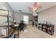 Home office with a desk, shelving, and carpet flooring at 12031 Longview Lake Cir, Bradenton, FL 34211