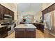 Open concept kitchen with granite island, stainless steel appliances, and breakfast area at 12031 Longview Lake Cir, Bradenton, FL 34211