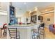 Kitchen breakfast bar with granite countertop and seating for three at 12031 Longview Lake Cir, Bradenton, FL 34211