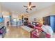 Living room with open floor plan, leather furniture and view into kitchen at 12031 Longview Lake Cir, Bradenton, FL 34211