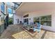 Covered patio with seating area and grill at 12031 Longview Lake Cir, Bradenton, FL 34211