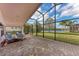 Spacious screened patio with lake view, perfect for outdoor enjoyment at 12031 Longview Lake Cir, Bradenton, FL 34211