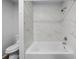 Clean bathroom with a bathtub and shower at 1215 E Venice Ave, Venice, FL 34285