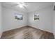 Well-lit bedroom with ceiling fan and wood-look floors at 1215 E Venice Ave, Venice, FL 34285
