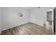 Bedroom with double door closet and wood-look floors at 1215 E Venice Ave, Venice, FL 34285