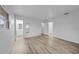 Bright bedroom with wood-look floors and access to bathroom at 1215 E Venice Ave, Venice, FL 34285