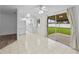 Bright dining area with tile floors and sliding glass doors leading to backyard at 1215 E Venice Ave, Venice, FL 34285