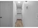 Bright hallway with built-in storage and wood-look floors at 1215 E Venice Ave, Venice, FL 34285