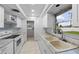 Clean kitchen, featuring white cabinets and updated appliances at 1215 E Venice Ave, Venice, FL 34285