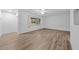 Living room with hardwood floors and a view into another room at 1215 E Venice Ave, Venice, FL 34285