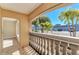 Bright balcony overlooks lush tropical landscaping and parking at 129 Tyler Dr # 101, Sarasota, FL 34236