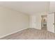Light and airy bedroom with wood-look floors and an ensuite bathroom at 129 Tyler Dr # 101, Sarasota, FL 34236