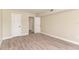 Well-lit bedroom with wood-look floors and ample closet space at 129 Tyler Dr # 101, Sarasota, FL 34236