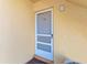 White front door with screen door and number 101 at 129 Tyler Dr # 101, Sarasota, FL 34236