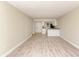Spacious living room with light walls and wood-look flooring at 129 Tyler Dr # 101, Sarasota, FL 34236