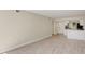 Bright living room features light wood-look floors and an open concept design at 129 Tyler Dr # 101, Sarasota, FL 34236