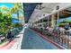 Outdoor patio seating area with umbrellas at 129 Tyler Dr # 101, Sarasota, FL 34236
