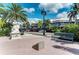 A statue, park bench, and shops line a tree-lined street at 129 Tyler Dr # 101, Sarasota, FL 34236