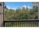 View from screened balcony showcasing lush green landscape at 129 Woodland Pl, Osprey, FL 34229