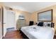Bedroom with double bed, dresser, and hardwood floors at 1330 Glen Oaks E Dr # 268D, Sarasota, FL 34232