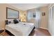 Bright bedroom with a double bed and hardwood floors at 1330 Glen Oaks E Dr # 268D, Sarasota, FL 34232