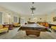 Spacious billiards room with a large pool table and comfortable seating at 1330 Glen Oaks E Dr # 268D, Sarasota, FL 34232