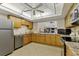 Well-equipped community kitchen with ample cabinetry and modern appliances at 1330 Glen Oaks E Dr # 268D, Sarasota, FL 34232