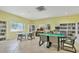Bright and inviting community library with books, tables, and computer station at 1330 Glen Oaks E Dr # 268D, Sarasota, FL 34232