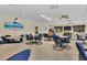 Community room with tables, chairs, and a TV at 1330 Glen Oaks E Dr # 268D, Sarasota, FL 34232