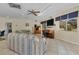 Relaxing community room features comfortable seating, a piano, and large-screen TV at 1330 Glen Oaks E Dr # 268D, Sarasota, FL 34232