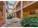 Ground level courtyard with walking path and plants at 1330 Glen Oaks E Dr # 268D, Sarasota, FL 34232