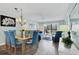 Bright dining room with a view of the living room and balcony at 1330 Glen Oaks E Dr # 268D, Sarasota, FL 34232