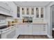 White cabinets, updated countertops and a view into the living area at 1330 Glen Oaks E Dr # 268D, Sarasota, FL 34232