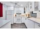 Modern white kitchen with updated appliances and quartz countertops at 1330 Glen Oaks E Dr # 268D, Sarasota, FL 34232
