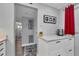 Kitchen features white cabinets, quartz countertops and built in coffee maker at 1330 Glen Oaks E Dr # 268D, Sarasota, FL 34232